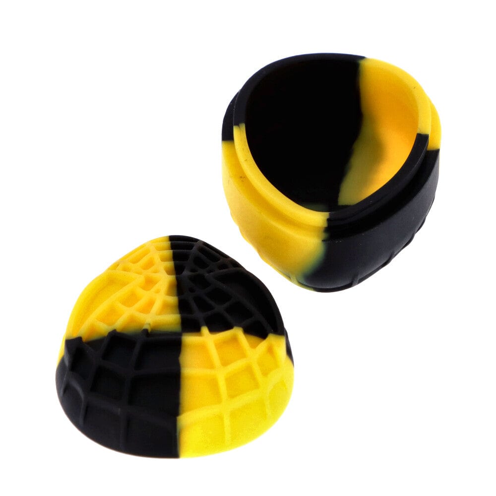 Top-down view of a yellow-and-black marbled Silicone Teardrop Container showing the open hollow half and the textured lid beside it.