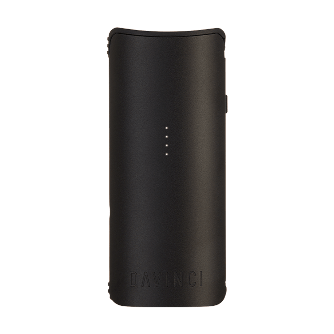 Front-facing view of the black DaVinci Miqro-C Vaporizer with four LED indicator dots centered on its matte curved body.