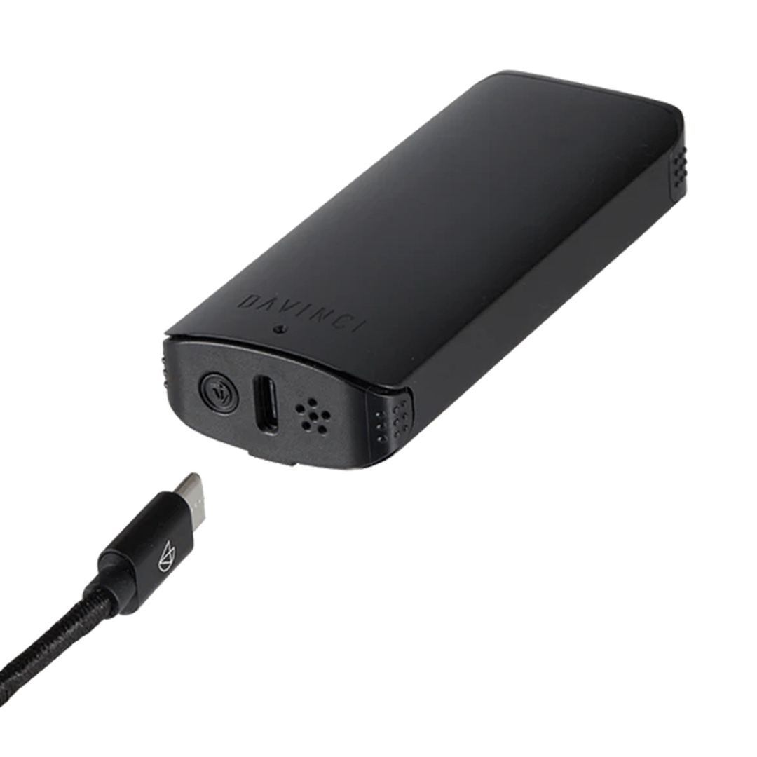A detailed side view of the Davinci ARTIQ, showing its sleek black design and textured surface.