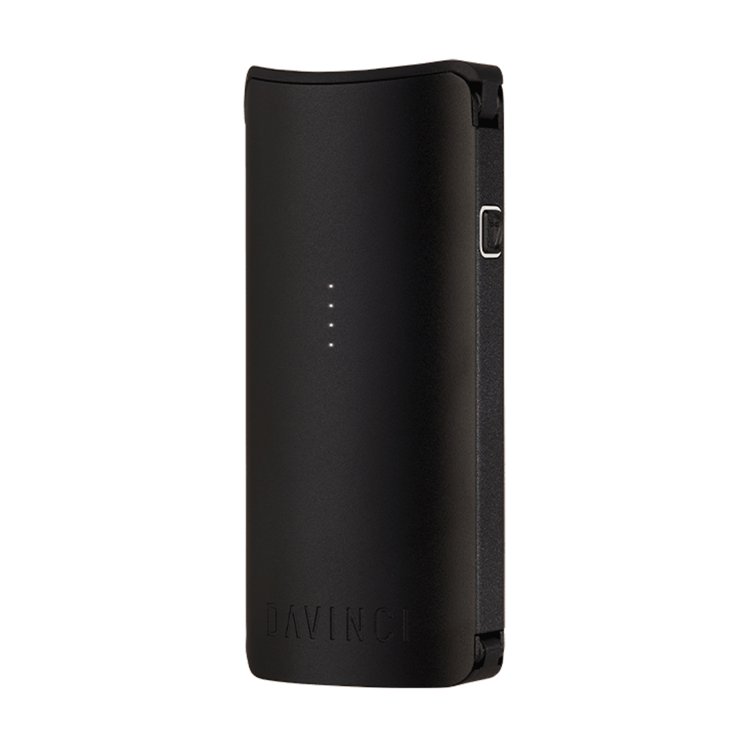 Slightly angled front view of the matte teal DaVinci Miqro-C Vaporizer showing its slim rectangular body, four vertical LED dots, and curved top against a white background