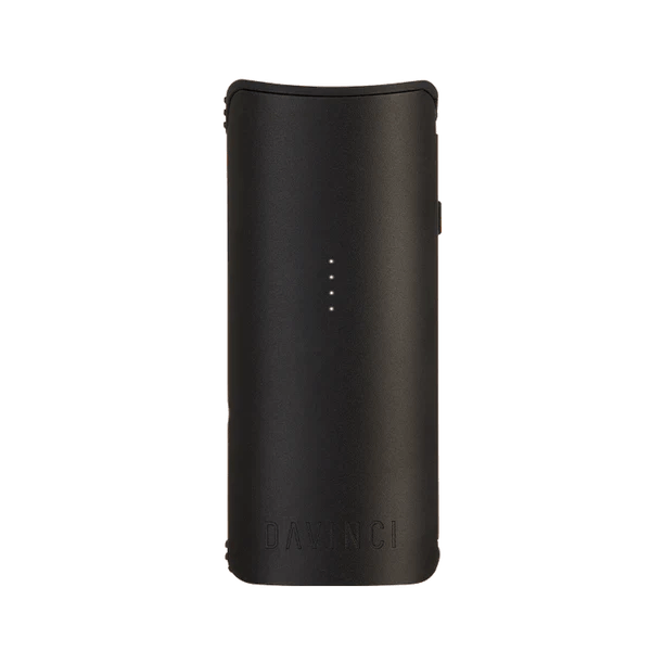 Front-facing view of the pink DaVinci Miqro-C Vaporizer standing upright on a white background, its four LED dots centered above the embossed DaVinci logo.