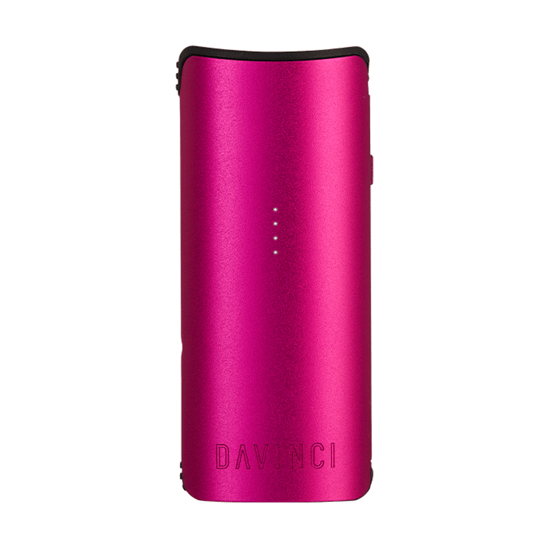 Front-facing image of the metallic pink DaVinci Miqro-C Vaporizer standing upright on a white background with four tiny LED indicator lights down the center.