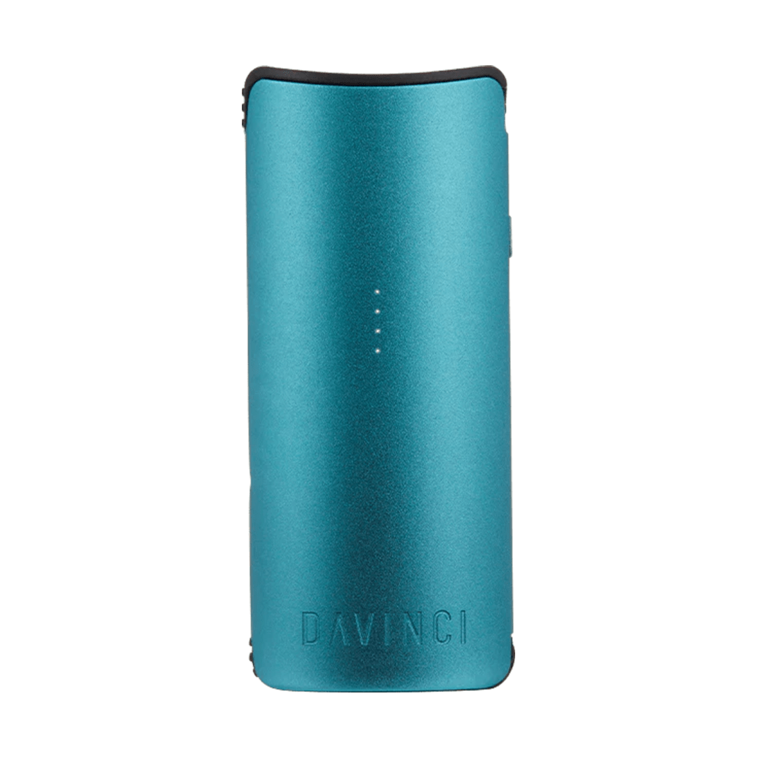 Front-facing view of the teal DaVinci Miqro-C Vaporizer standing upright on a white background with four small LED indicator lights centered on its curved metal body.