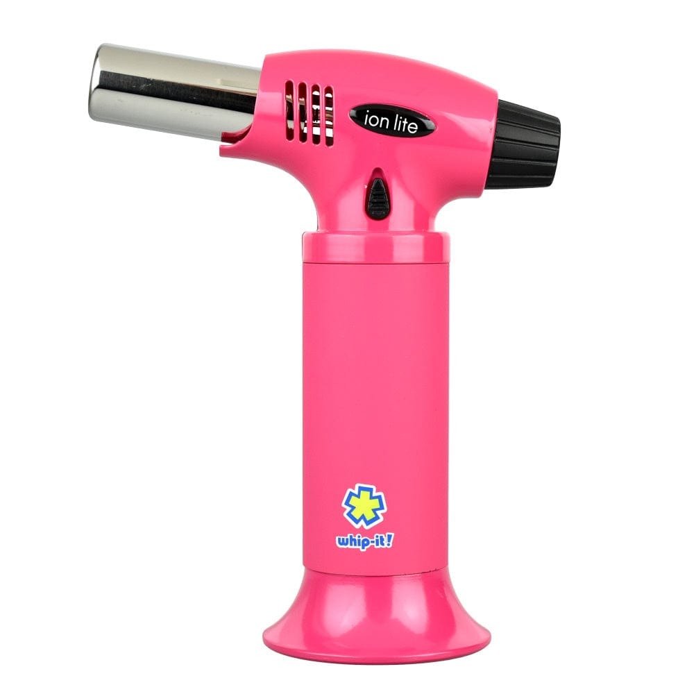 Straight-on studio view of the Whip-It! Ion Lite Torch Lighter in glossy red showing its T-shaped body, chrome nozzle, black rear cap, and small Whip-It! logo on the base
