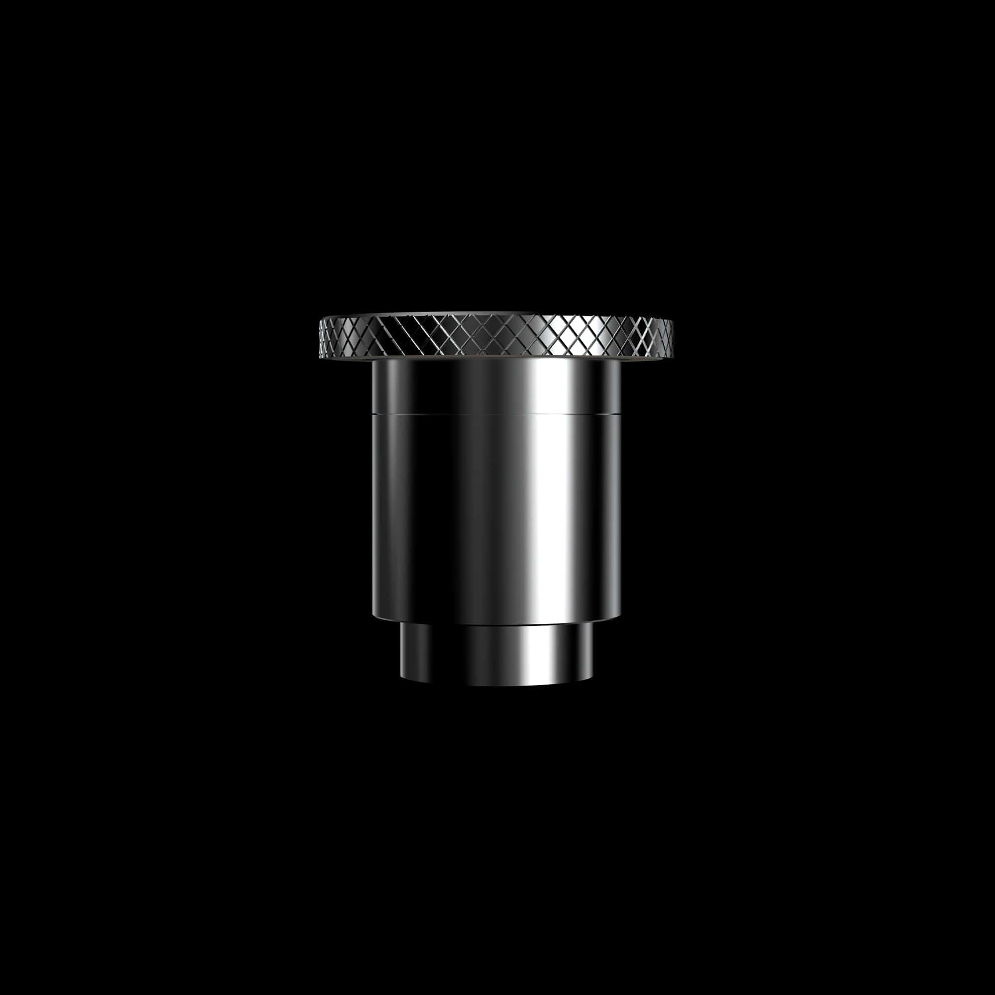 Close-up portrait of the metallic Boost Evo™ Quartz Atomizer top with knurled edge and reflective cylindrical body against a black background