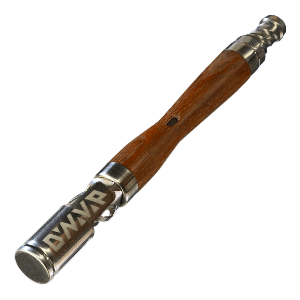 Close-up, angled view of The WoodWynd, showcasing its smooth, dark wood finish and cylindrical shape.