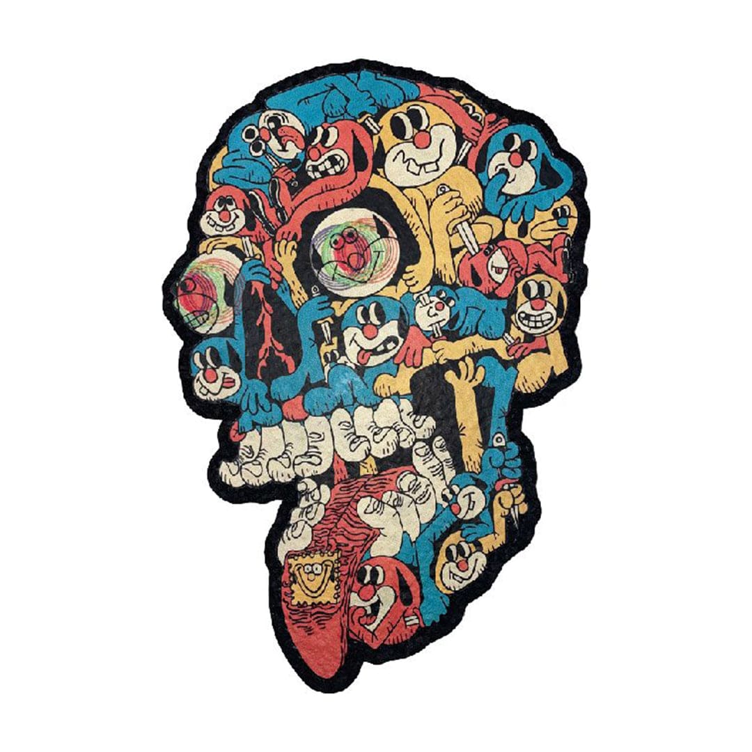 A top-down view of the 10" Dab Mats featuring a cartoonish illustration of a face with many eyes and a grinning mouth.