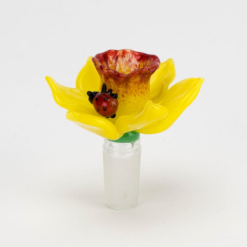 A close-up shot of the Daffodil Bowl Piece, showcasing its colorful, flower-shaped glass design against a white background.