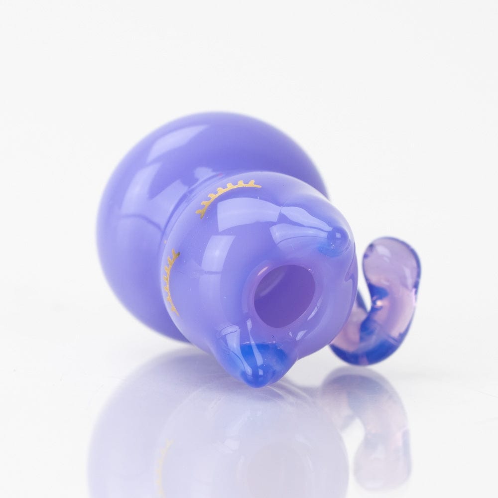 A close-up, angled view of the SakiBomb Kitty Carb Cap, reflecting light on its polished surface.