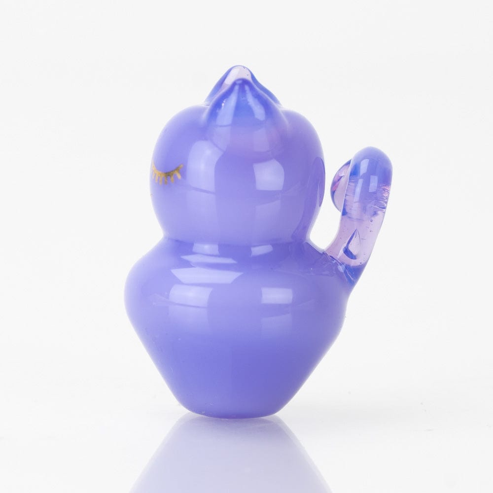 A close-up, angled view of the SakiBomb Kitty Carb Cap, showcasing its smooth, reflective surface against a white backdrop.