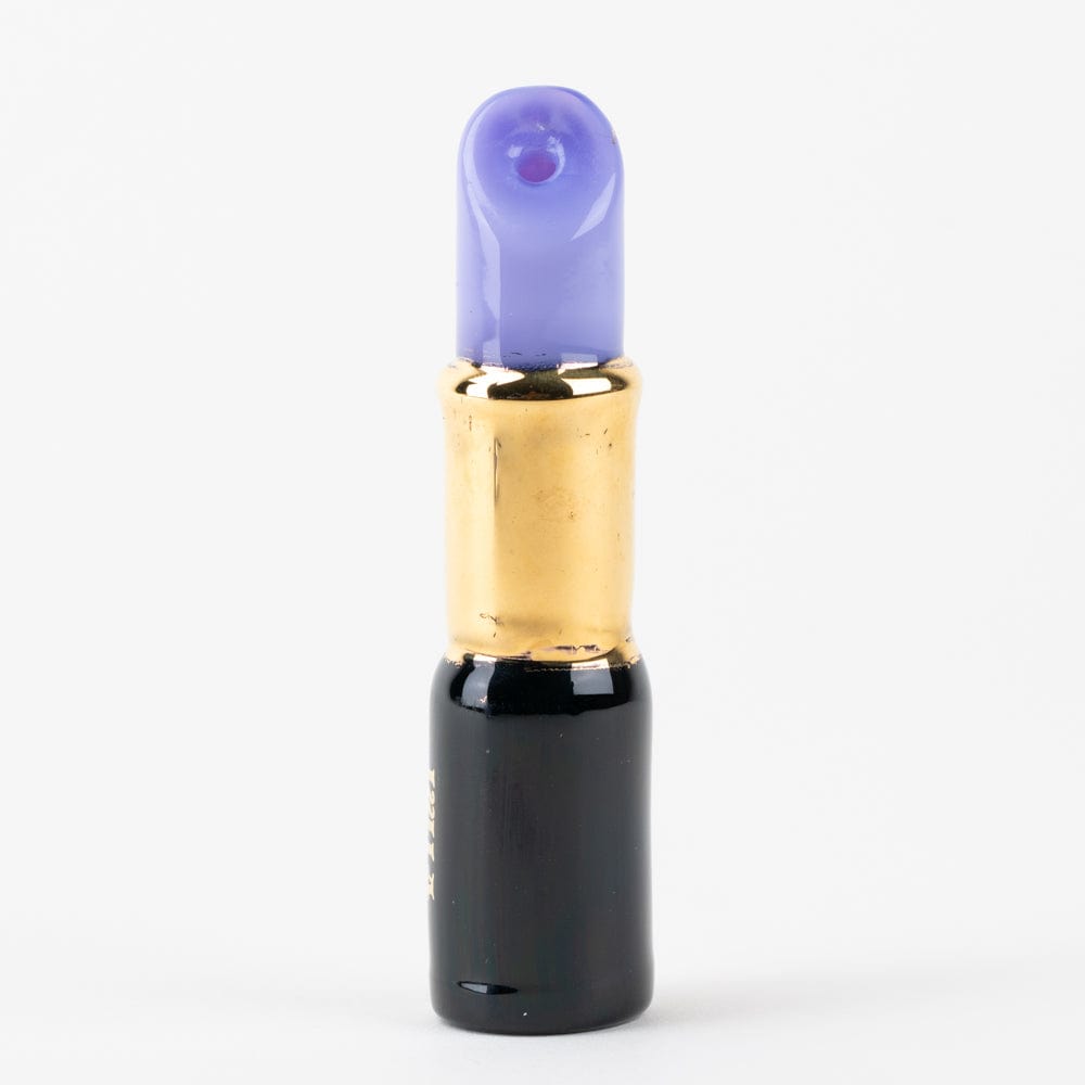 A close-up, angled view of the purple SakiBomb Lipstick Chillum, showcasing its sleek, cylindrical shape.