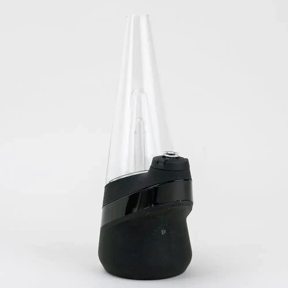 Front-facing studio shot of the Empire Glassworks PuffCo 'New Peak' & Proxy Glass Joystick Cap - Clear showing the tall clear glass peak mounted on a black angled base against a plain white background.