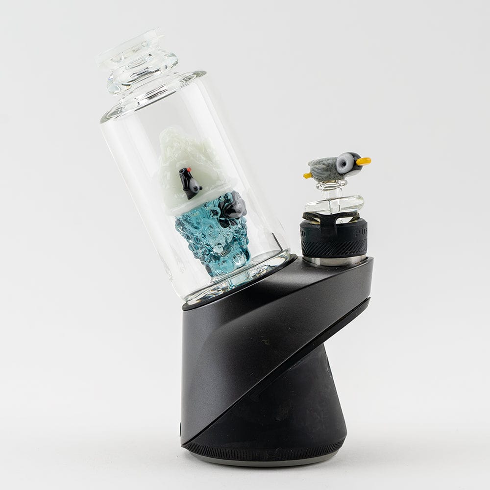 A close-up, angled view showcases the “Avenge the Arctic” Puffco Peak & Peak Pro Glass Attachment with a blue-tinted glass design.