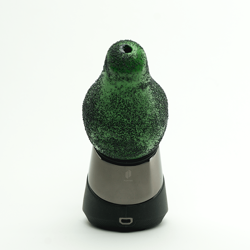 Front view of the Avocadope PuffCo Peak & Peak Pro Glass Attachment, a green glass piece angled on a dark surface.