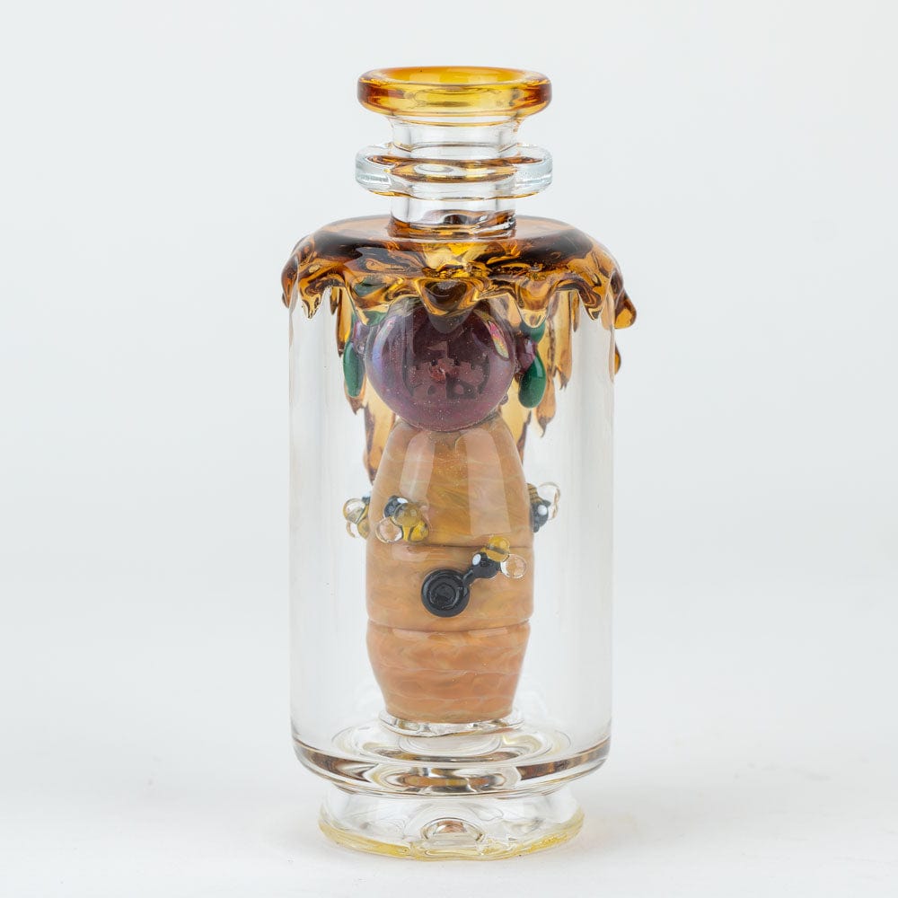 A detailed, angled view of the “Save the Bees” PuffCo Peak & Peak Pro Glass Attachment with a honey-toned, sculpted design.
