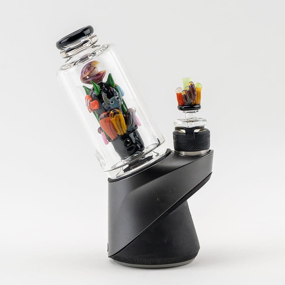 A three-quarter view of the “Save the Seas” Puffco Peak & Peak Pro Glass Attachment, showcasing its colorful, oceanic-themed design.