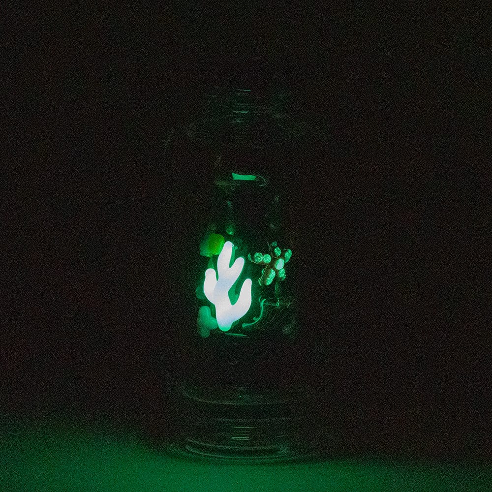 A close-up, low-angle view of the “Save the Seas” Puffco Peak & Peak Pro Glass Attachment, featuring a sculpted ocean-themed design.
