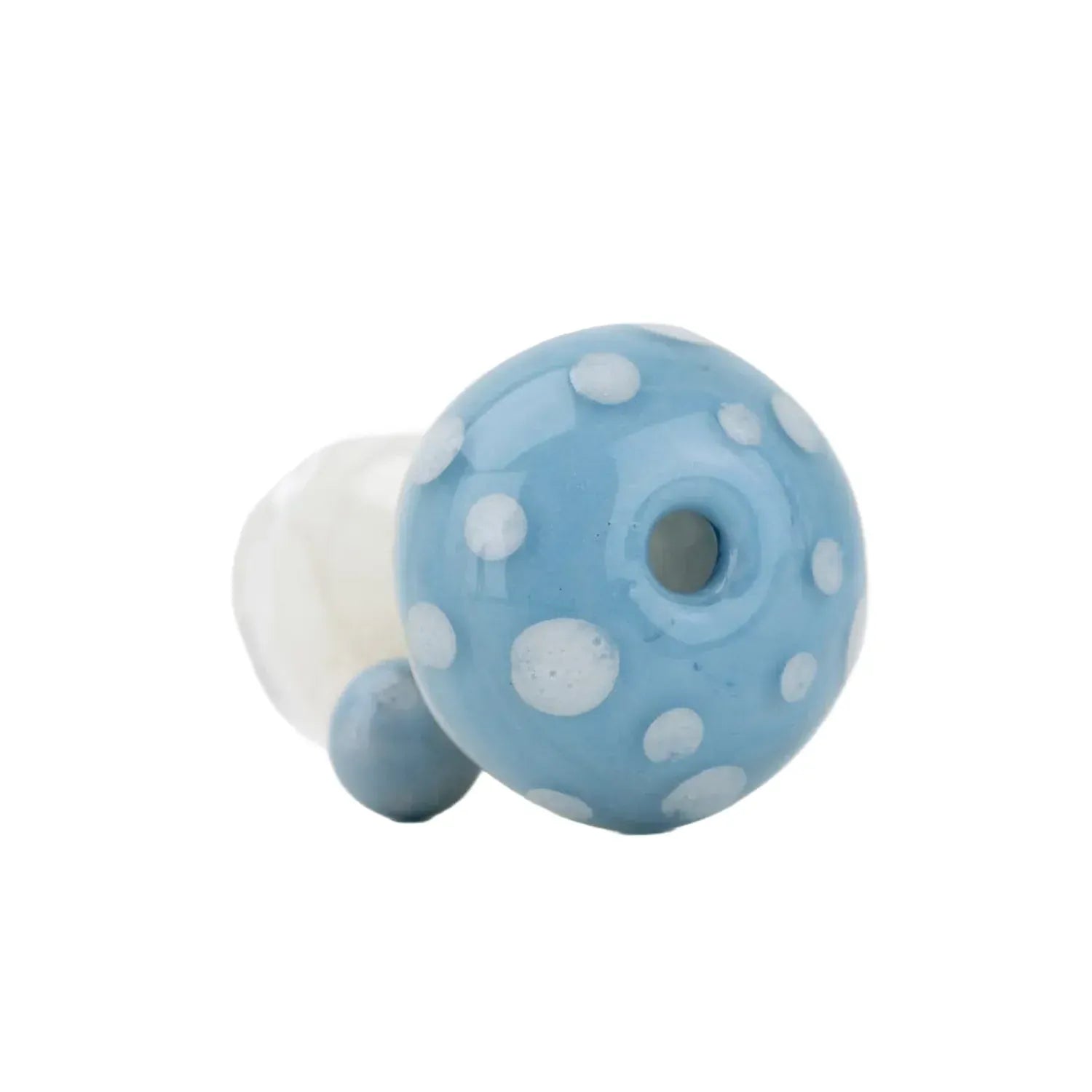 Close-up, angled view of the blue, white-dotted Empire Glassworks PuffCo Pivot Glass Mouthpiece - Blue Mushroom against a plain white background.