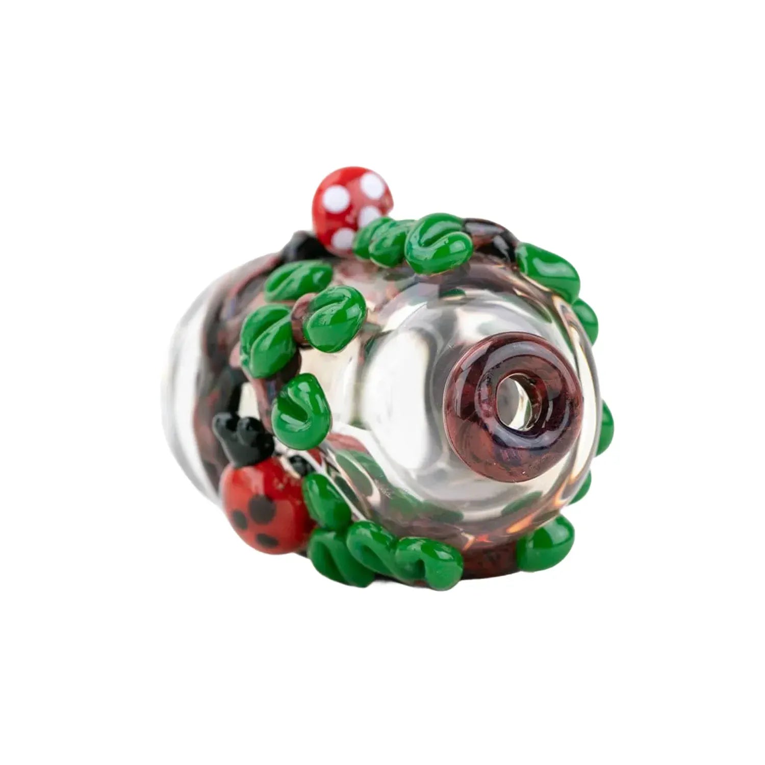Close-up angled view of the Empire Glassworks Puffco Pivot Glass Mouthpiece - Renew the Redwoods showing clear glass with raised green leaf and red mushroom details.