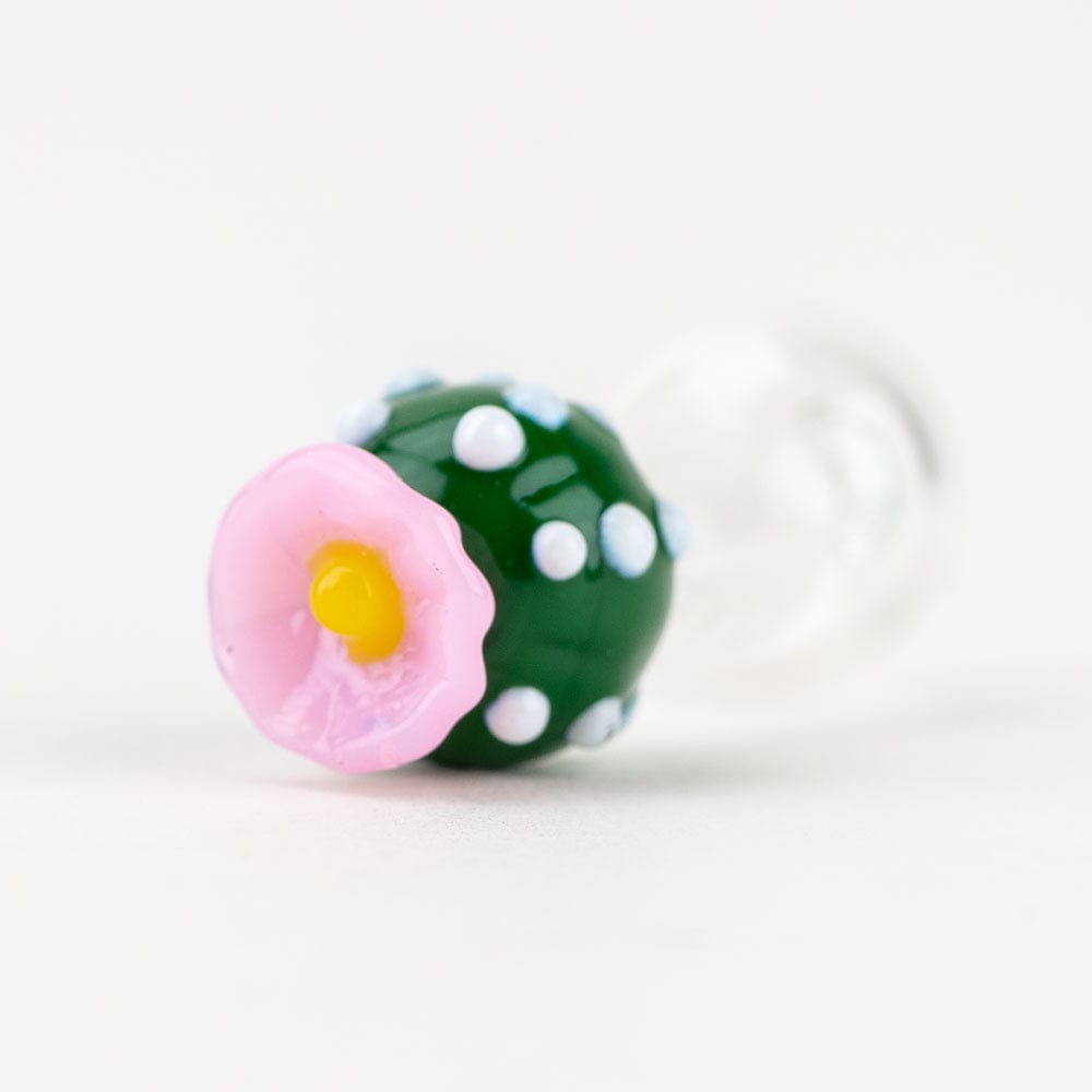 Close-up angled view of the Peyote PuffCo Peak Pro Glass Ball Cap, showcasing its colorful, floral-inspired design.