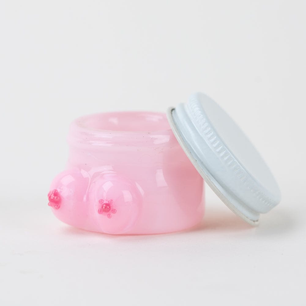 A slightly angled studio shot of the Boobies Terp Jar, showing its clear glass and screw-on lid.