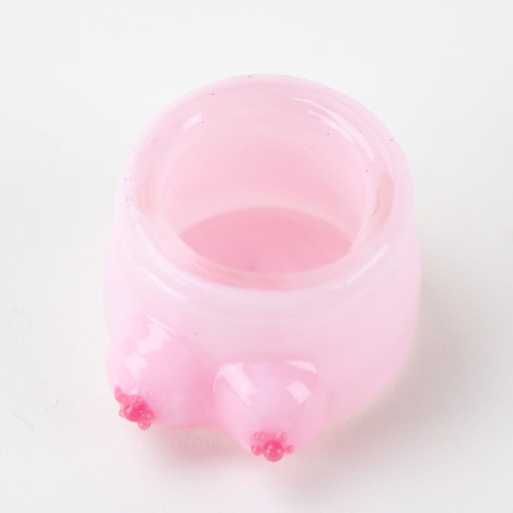 Front view of the Boobies Terp Jar, a small, clear glass container with a rounded shape and smooth surface.
