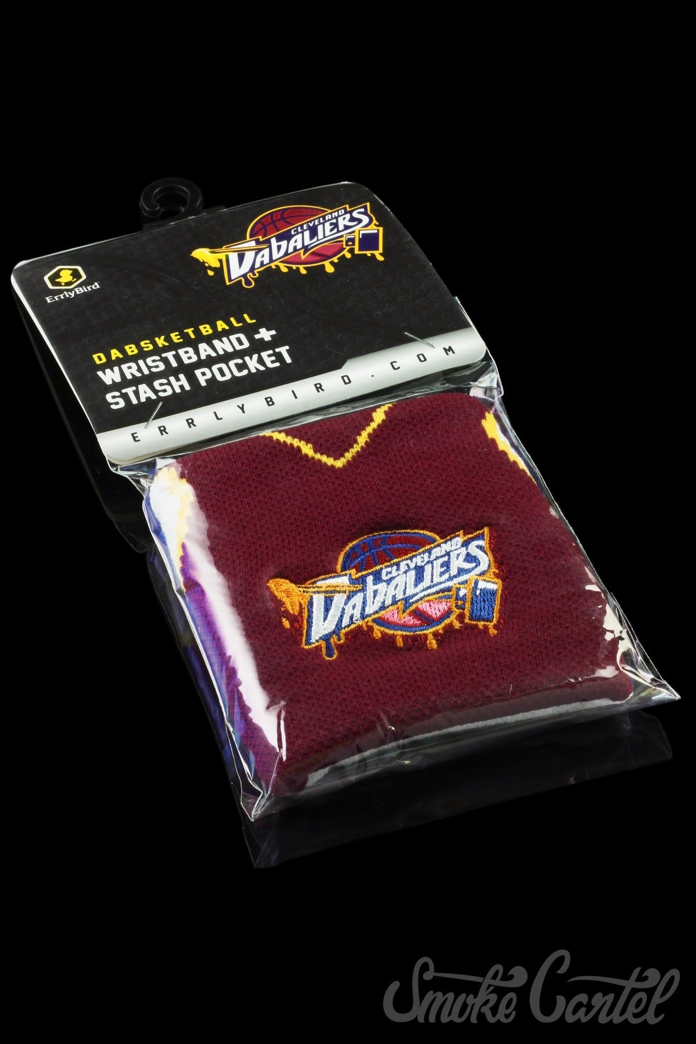 A close-up of the Stash Pocket Wristband with visible branding on its packaging, shown against a dark backdrop.