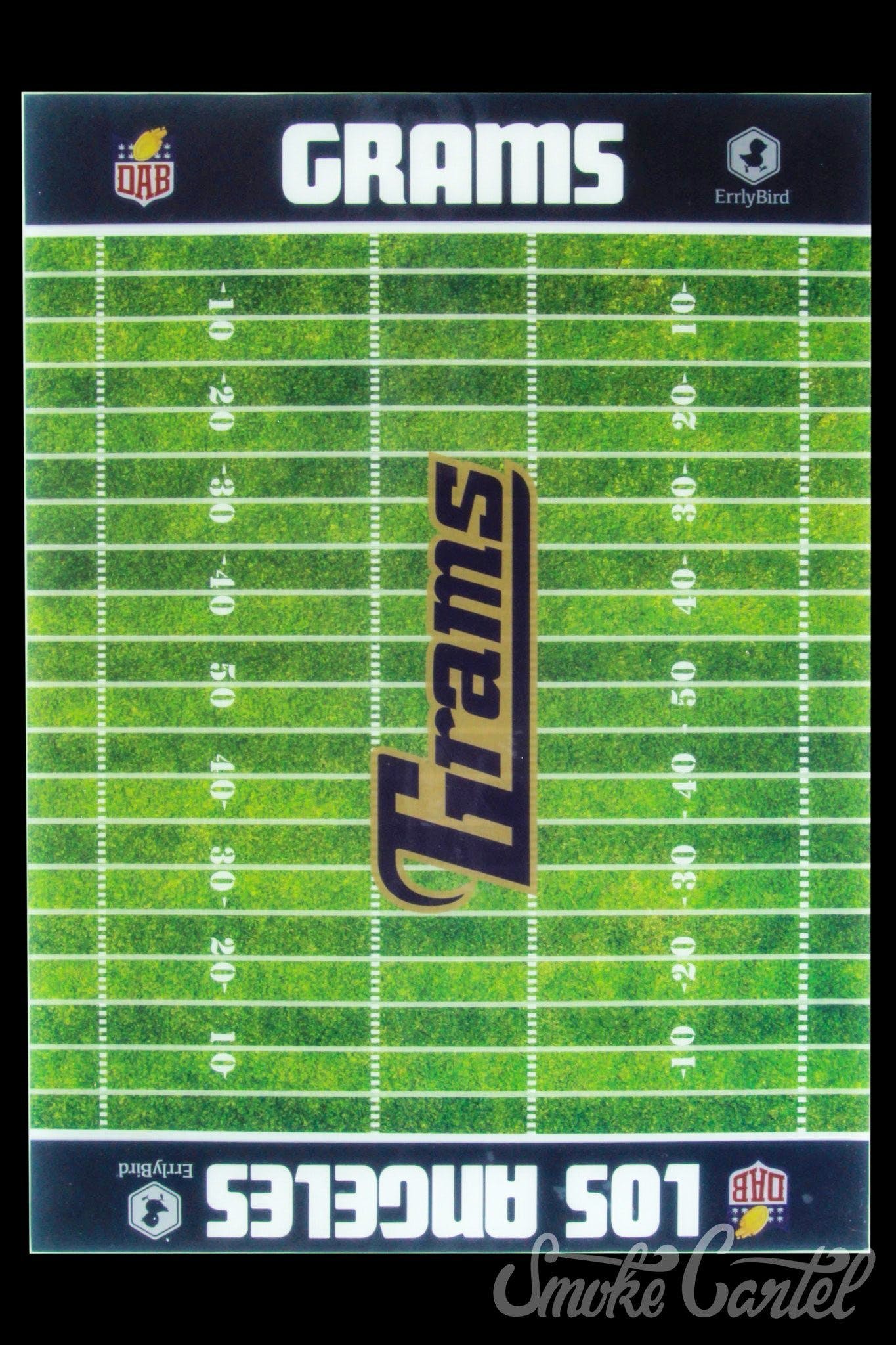 Top-down view of a green football field mat with yard lines and a vertical "Grams" logo, labeled Football Silicone Mat.