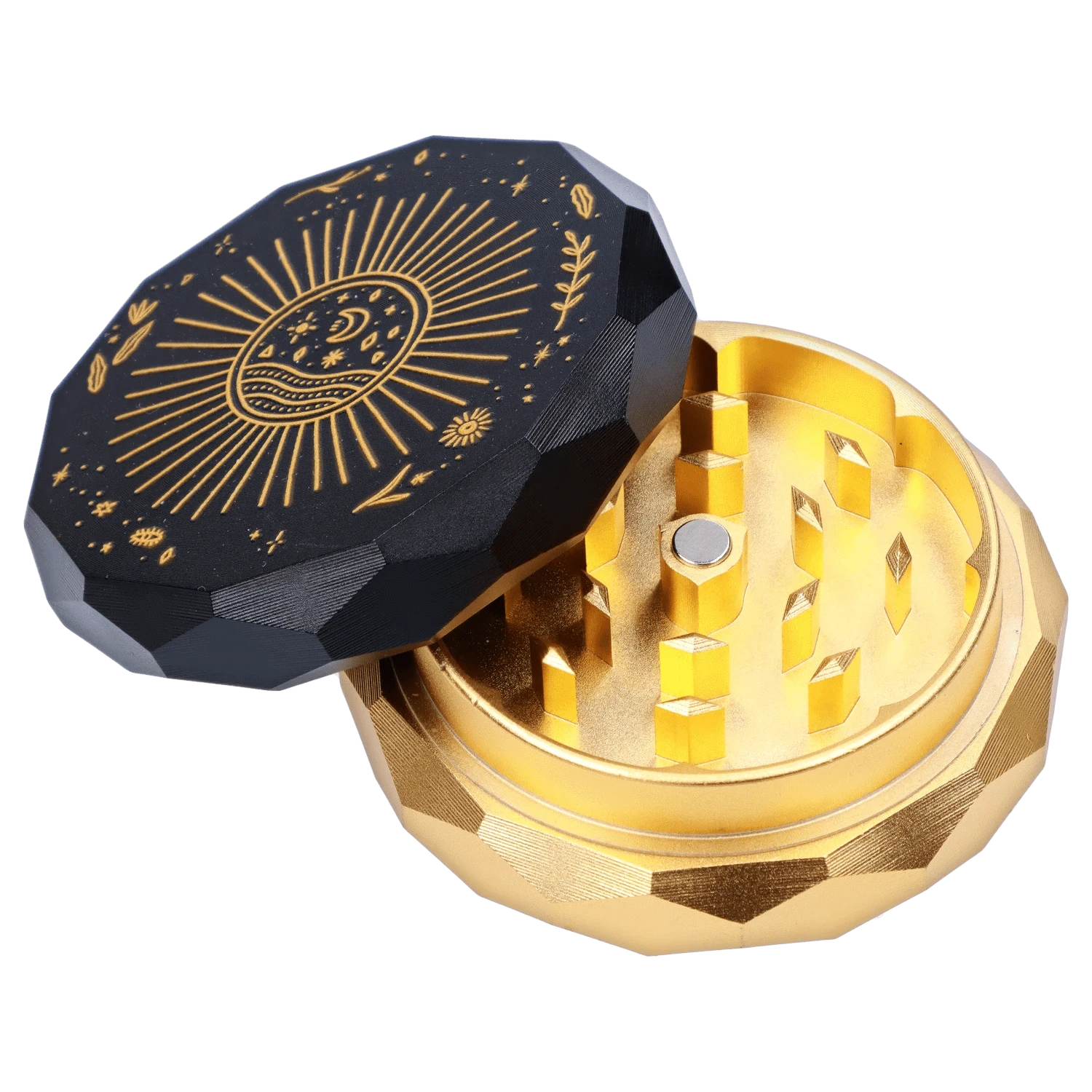Angled close-up of the Famous X Astral Power Aluminum 2 Stage Grinder -Black and Gold showing its faceted black lid with gold celestial engraving and the gold inner teeth.