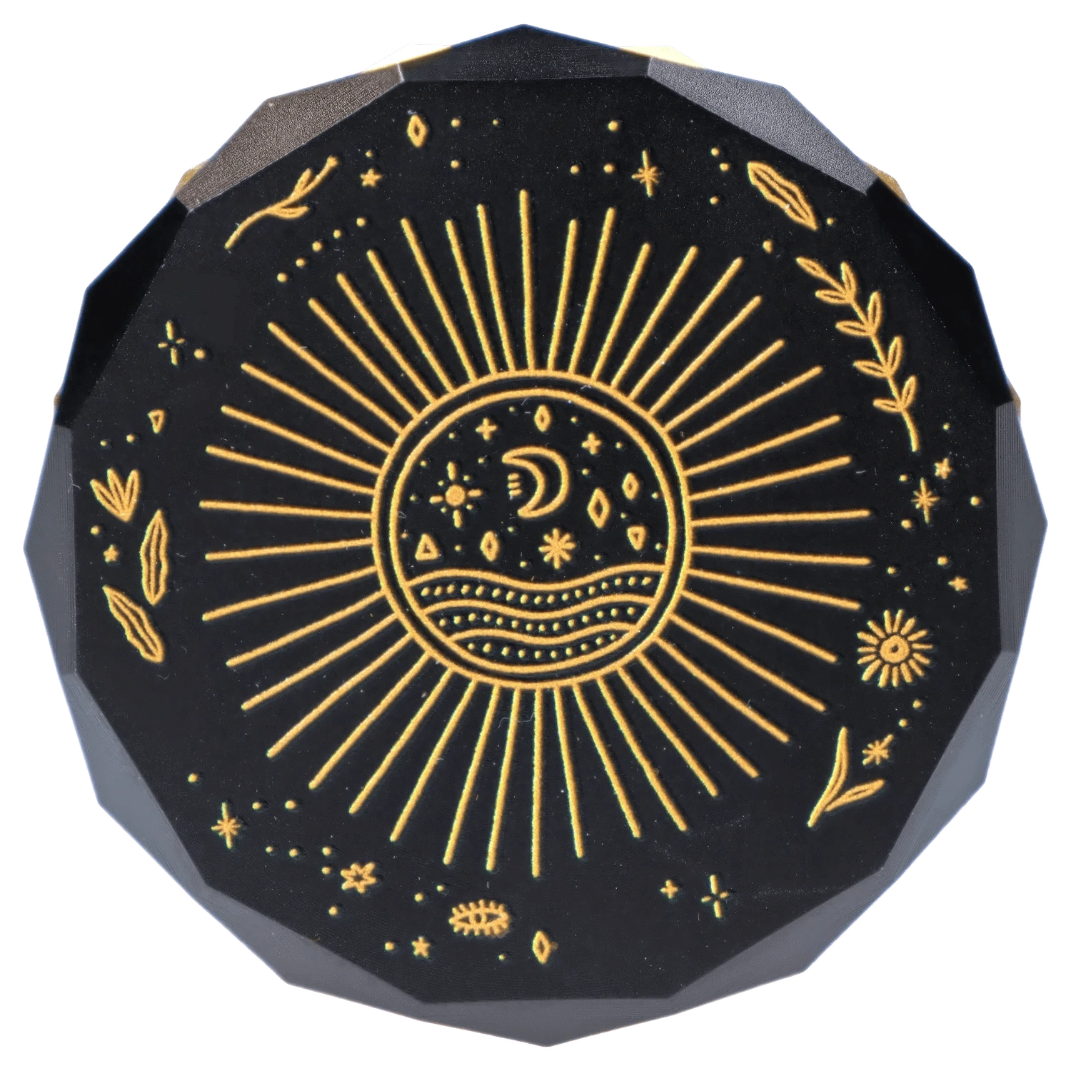 Top-down view of the Famous X Astral Power Aluminum 2 Stage Grinder -Black and Gold showing a black octagonal lid with gold sunburst and celestial moon and star etching.
