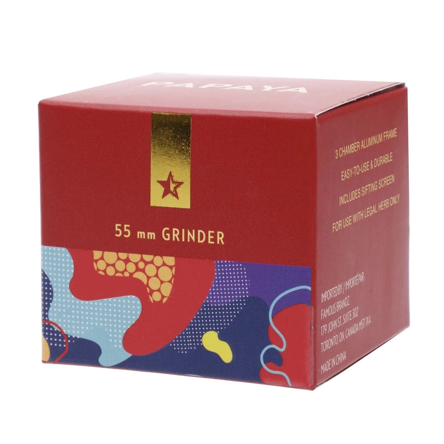 Angled close-up of the red box packaging for the Famous X Papaya Aluminum 3 Stage Grinder-Rose Gold showing a gold star tab, "55 mm GRINDER" text, and colorful abstract pattern.