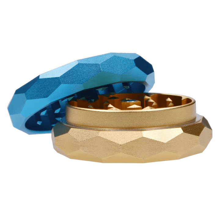 A top-down view of the open Floral Lush Aluminum 2 stage Grinder, showcasing its multi-faceted design and silver interior.