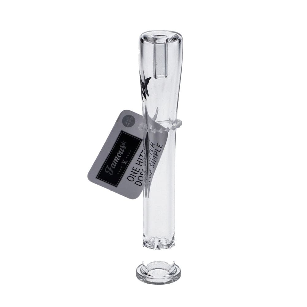 A close-up, angled view of the Famous X Clear One Hitter hand pipe made of clear glass.