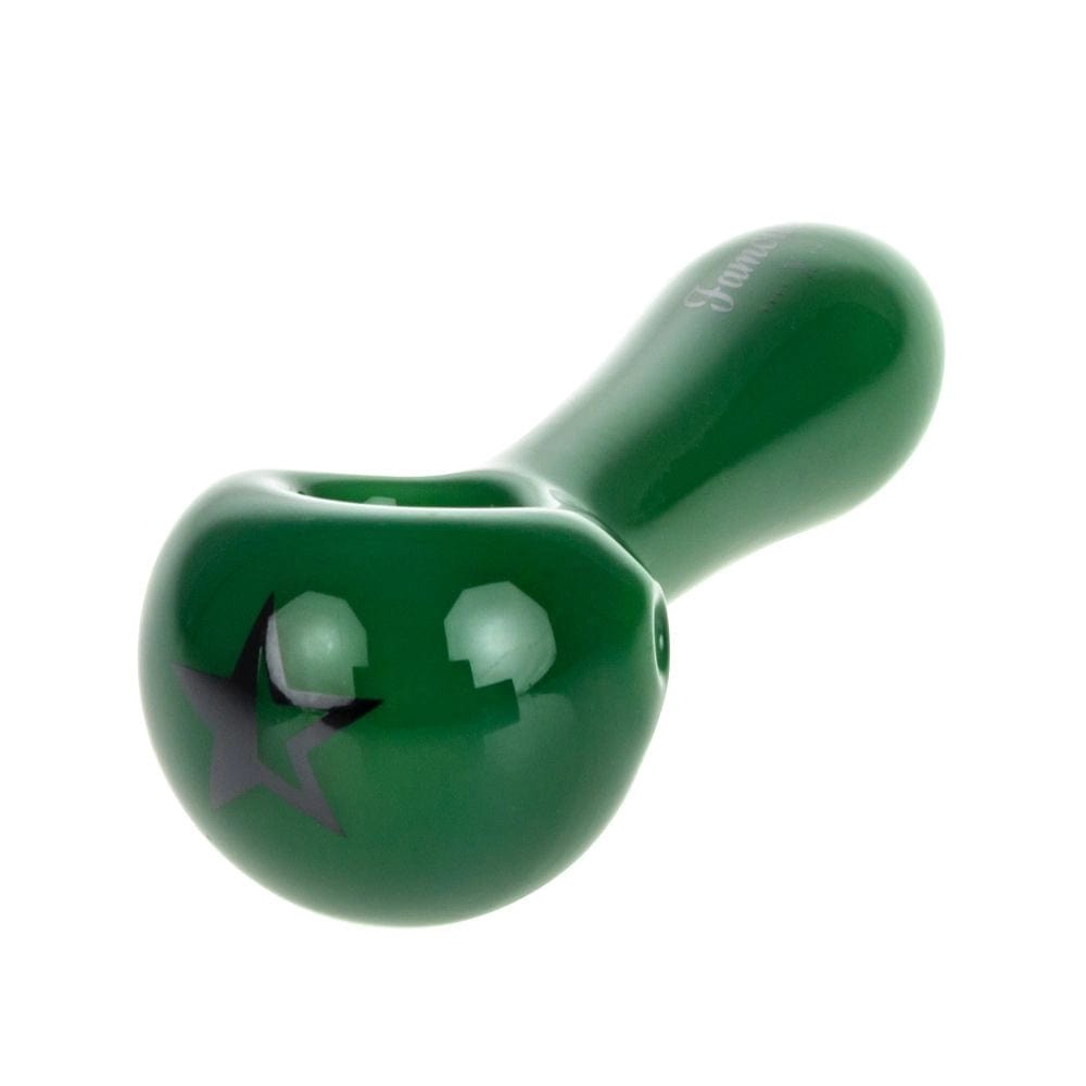A studio shot of the Famous X Milky Jade Spoon Pipe, highlighting its smooth, jade-colored glass design.