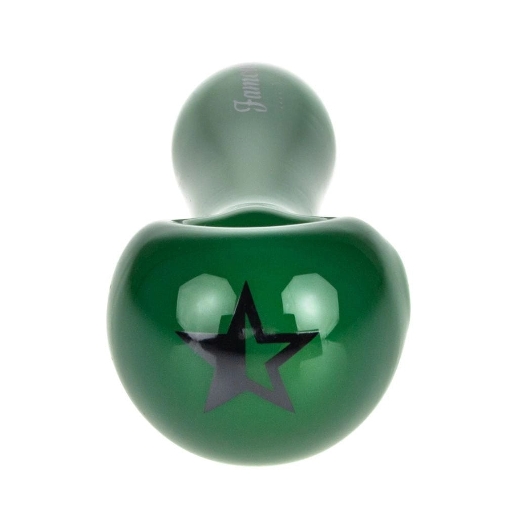 A detailed studio shot of the Famous X Milky Jade Spoon Pipe, showcasing its smooth, rounded form against a neutral backdrop.