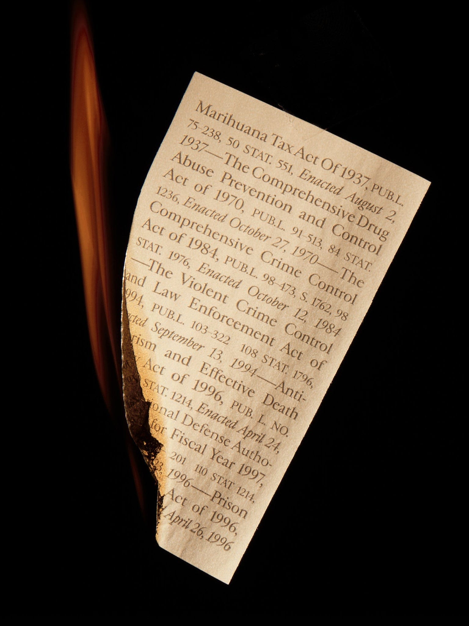 Close-up of the Field Trip x Last Prisoner Project Burn Book Pre-Roll Cones packaging, resembling aged legal documents with faded text.