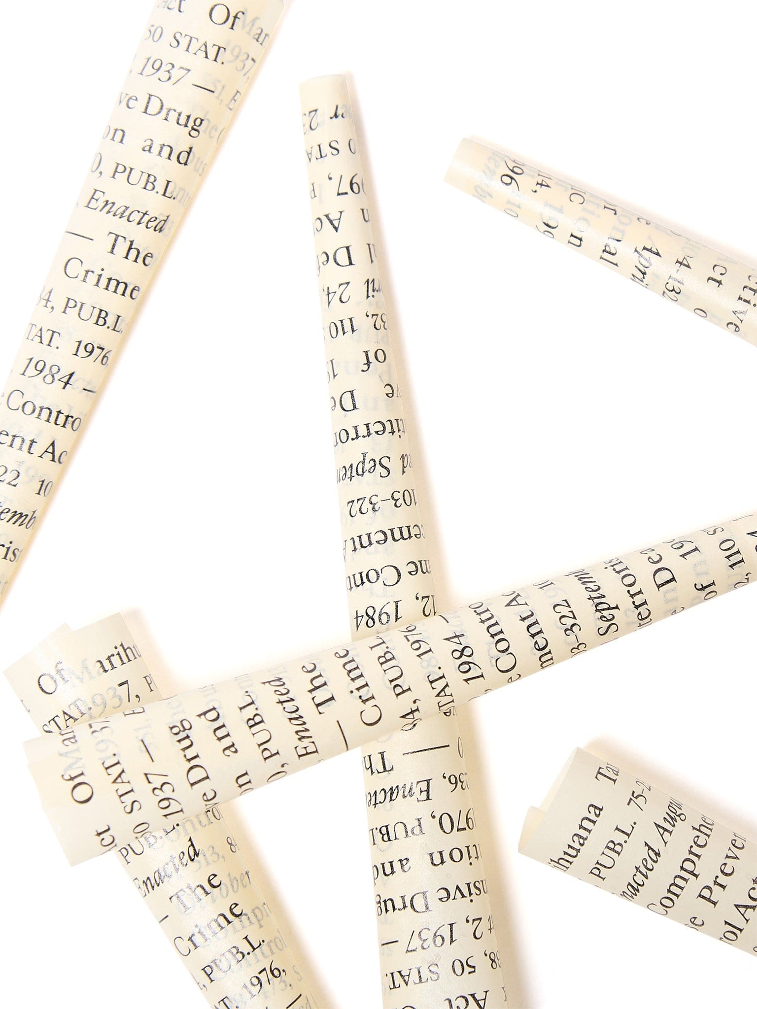 Overhead view of the Field Trip x Last Prisoner Project Burn Book Pre-Roll Cones against a blurred, text-filled backdrop.