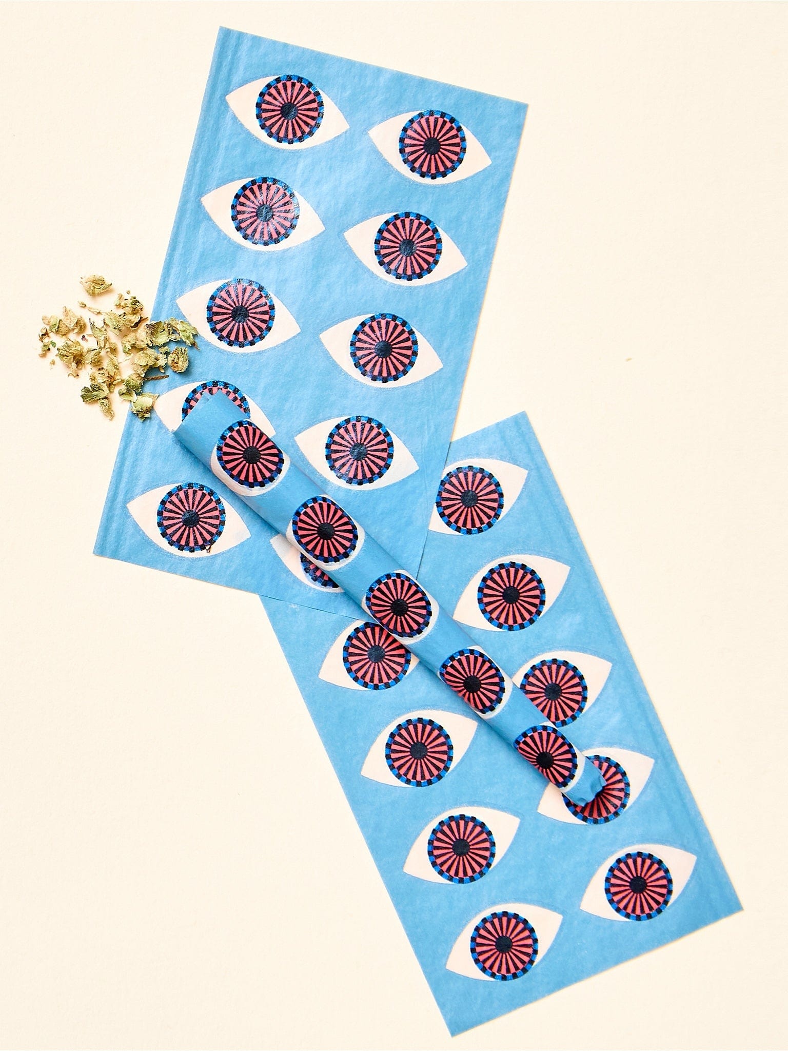 Overhead view of Third Eye Pre-Roll Cones arranged on a bright surface, showcasing their patterned designs.