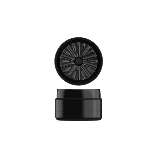 Close-up of the black Next-Gen Premium 2.5" Aluminum Series, showing a circular opening with ribbed detailing against a dark background.