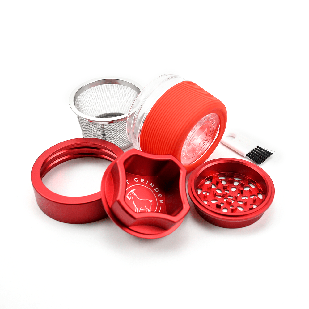 AITH v.I – OG Grinder Jar displayed with its parts separated, showing a close-up of the red, textured jar and its filtering components.
