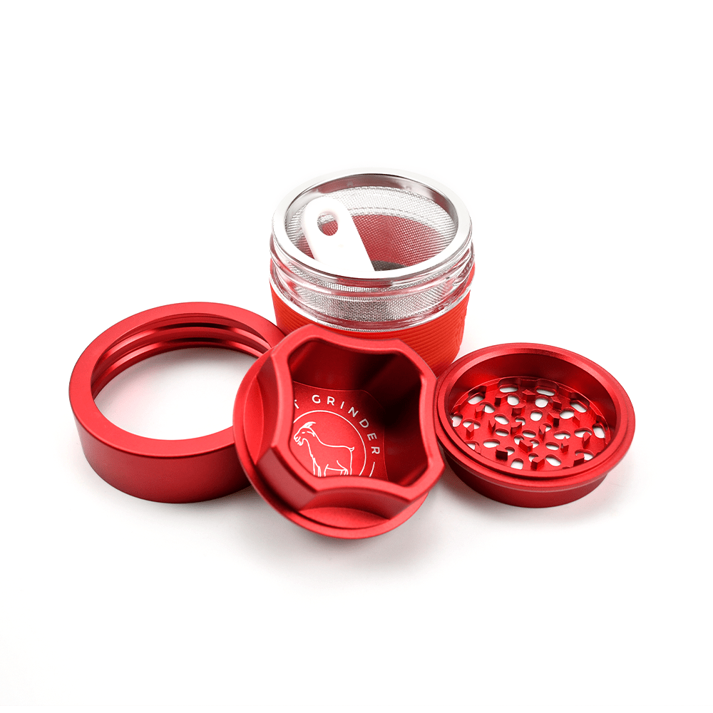 AITH v.I – OG Grinder Jar shown from above, displaying its disassembled, multi-part construction with a metallic finish.