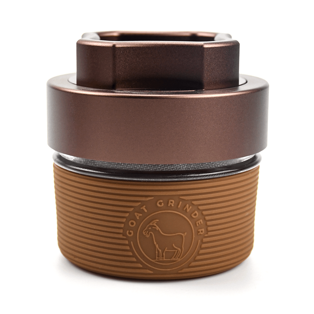 Front view of the AITH v.I – OG Grinder Jar, a closed, metallic container with a sleek, cylindrical design.