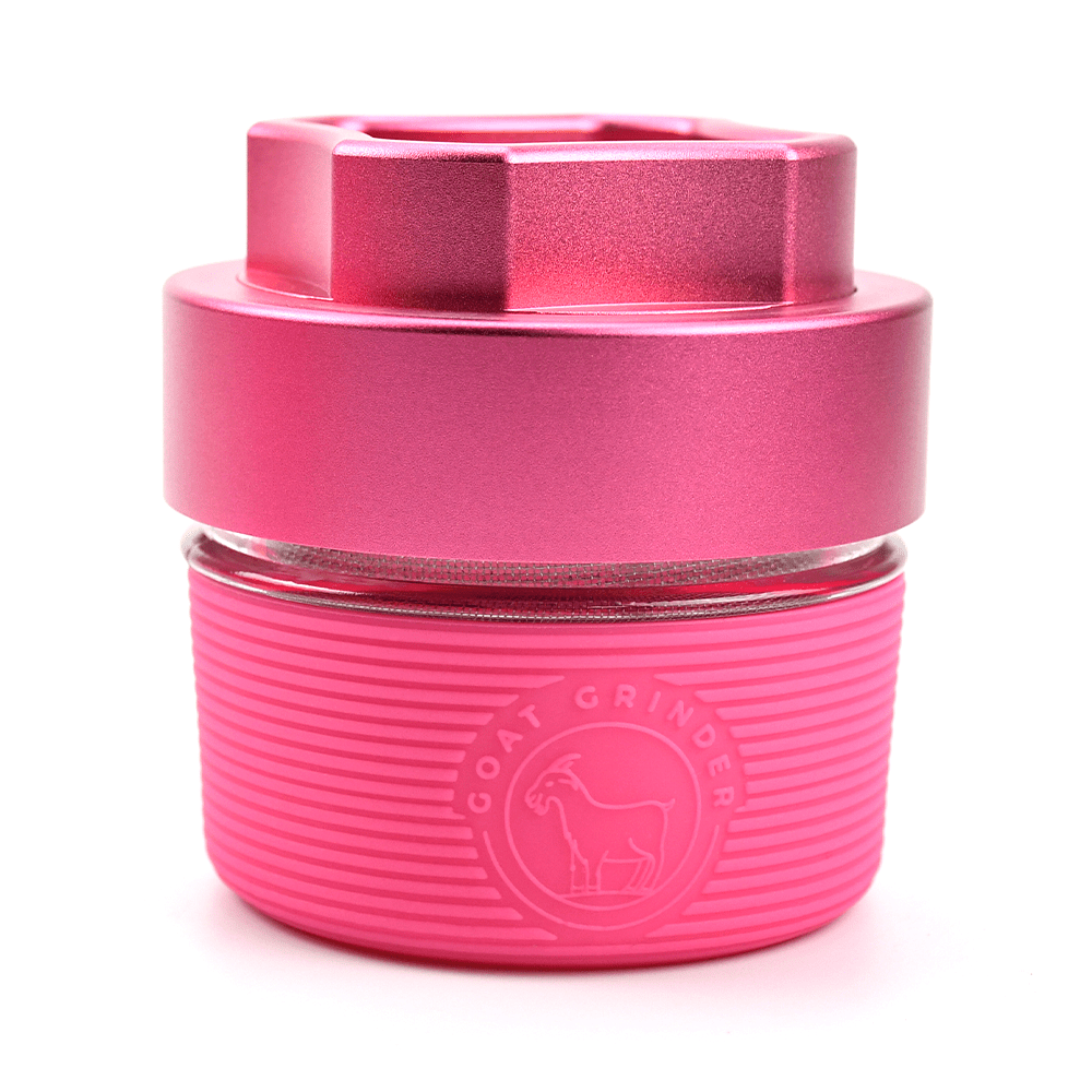 Close-up, angled view of the AITH v.I – OG Grinder Jar, showcasing its metallic finish and simple cylindrical shape.