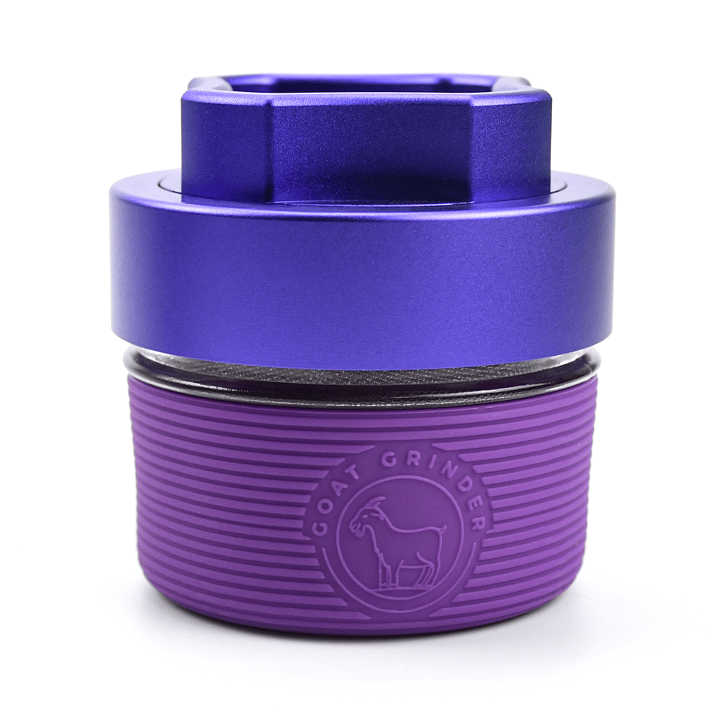 Front view of the AITH v.I â€“ OG Grinder Jar, a purple, cylindrical container with a textured cap.