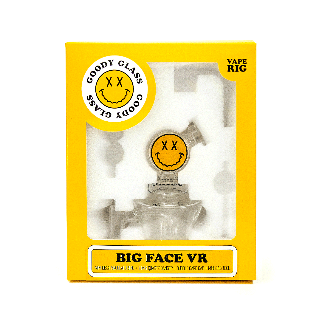 Front view of the Big Face VR Vape Rig, a clear glass piece with a unique patterned design against a dark background.