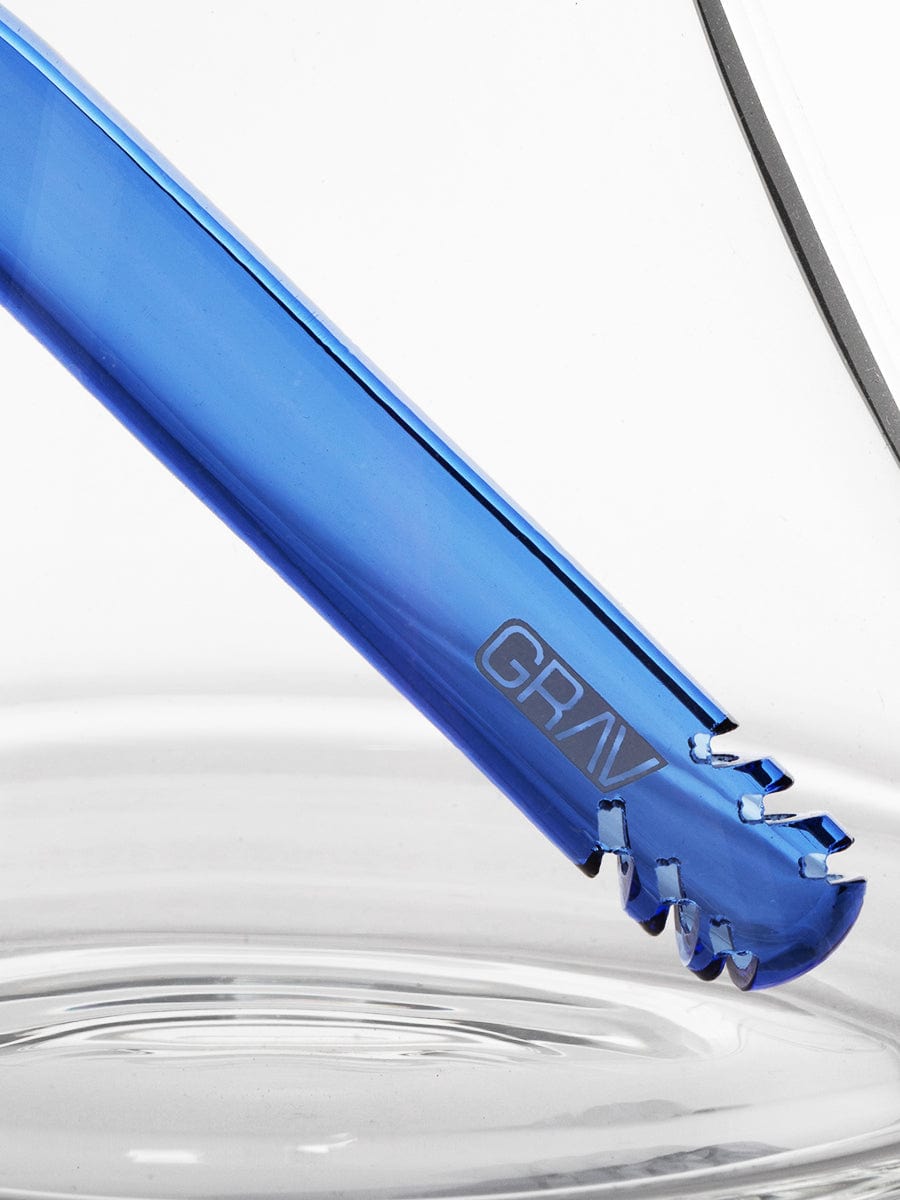 A close-up, angled view of the Medium Accented Deco Beaker Bong with light reflecting off its blue glass surface.