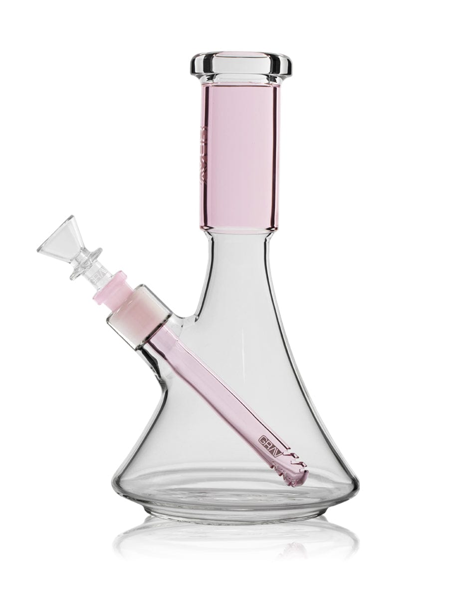A front view of the Medium Accented Deco Beaker Bong, showing the clear glass design and angled base reflecting on a glossy surface.