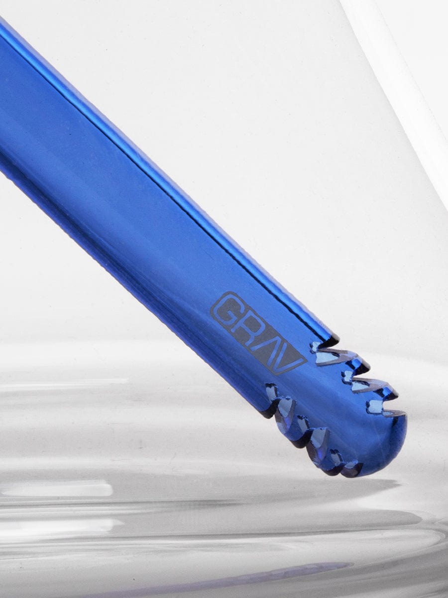 Close-up, angled view of the Large Accented Deco Beaker Bong, showcasing its textured, blue glass construction.