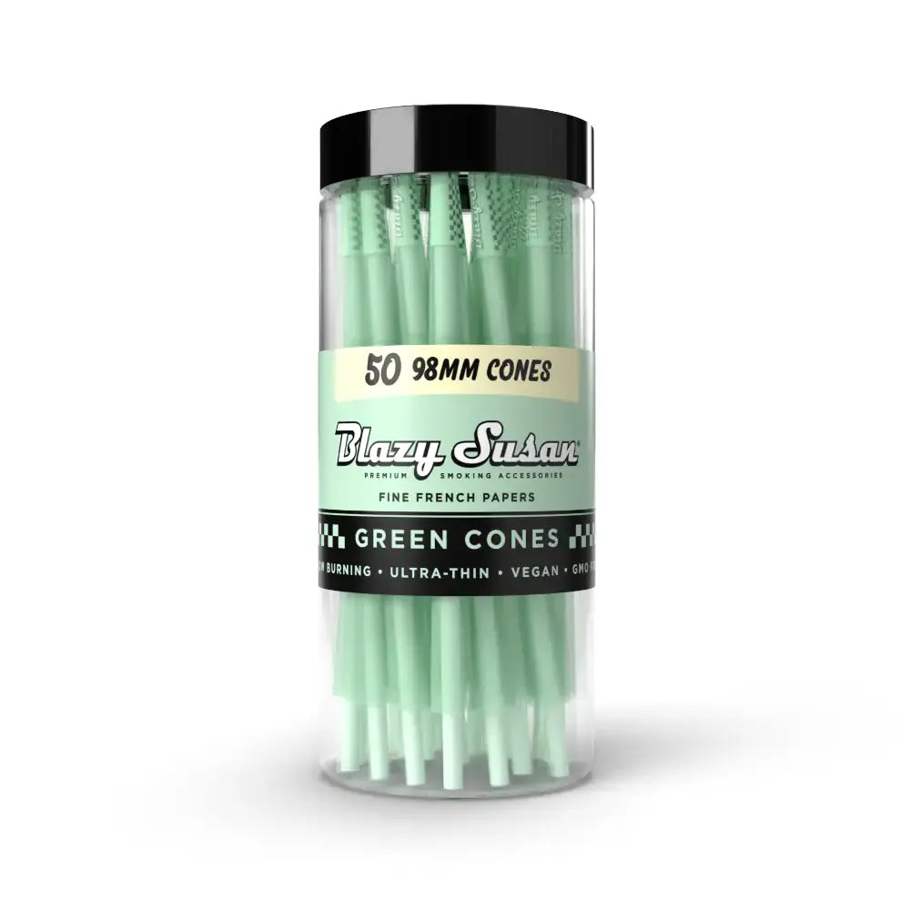Front view of a clear jar of Blazy Susan Green Cones showing mint-green prerolled cones upright against a white background.