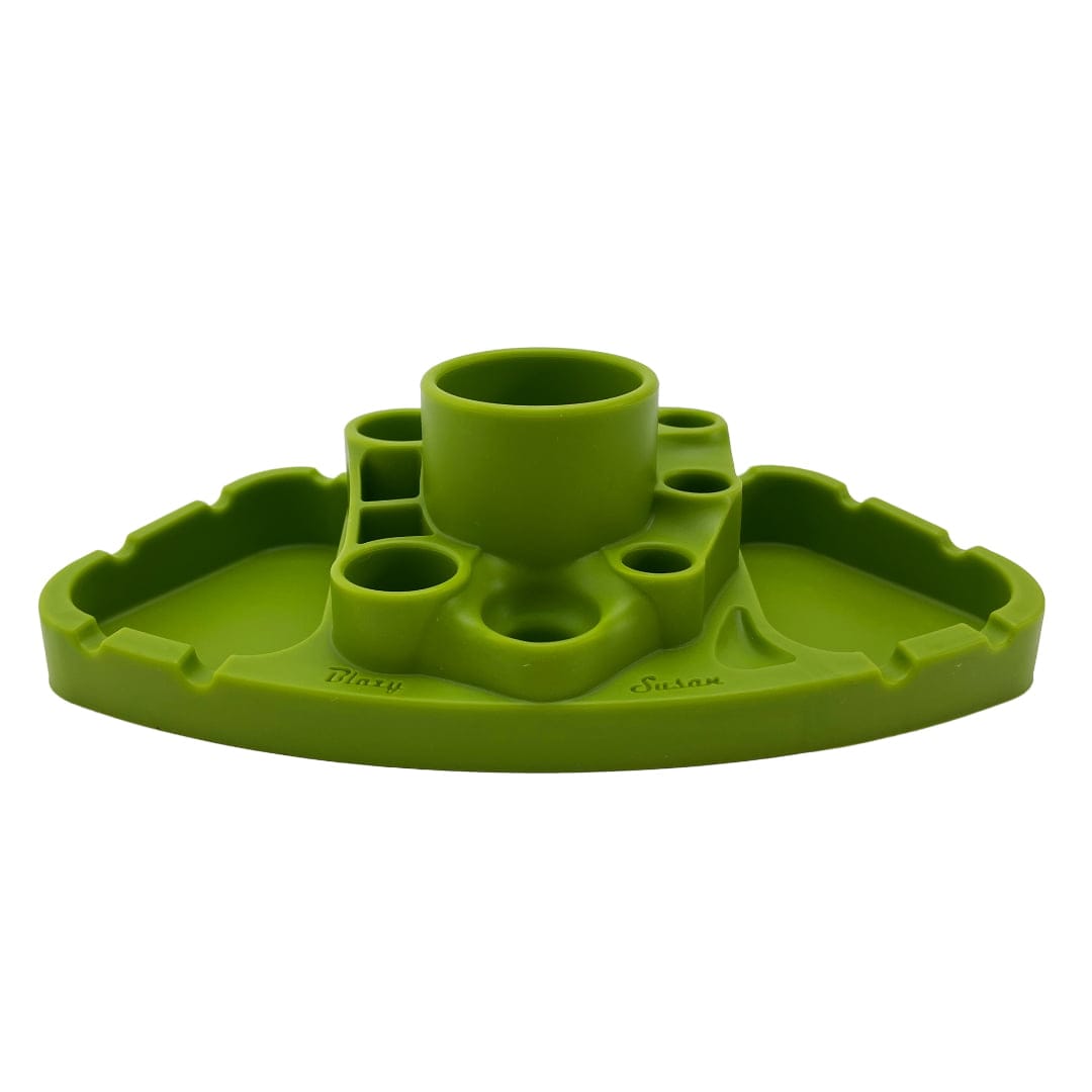 Front-facing shot of the green Blazy Susan Deluxe Dab Station showing its central cup and multiple circular wells recessed into a triangular base on a white background
